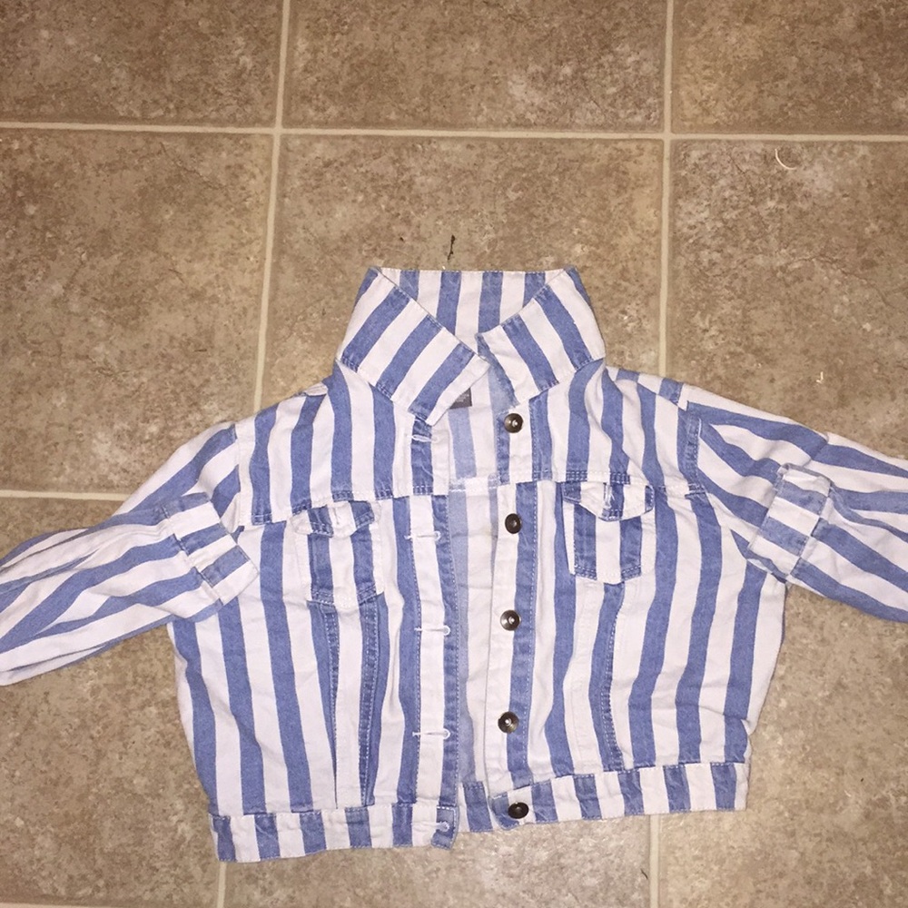 A colored , blue and white jean jacket.